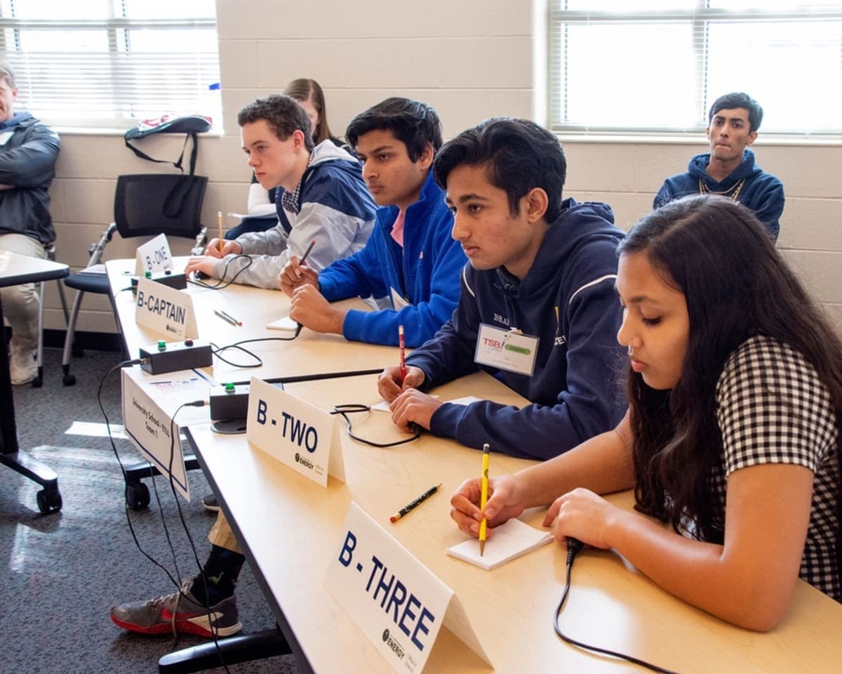 Students working at benches during a science session