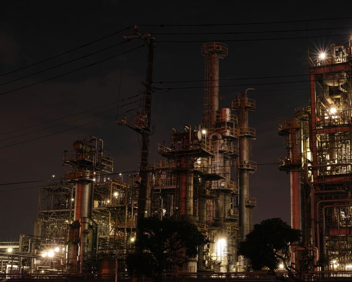 Oil refinery lit up at night