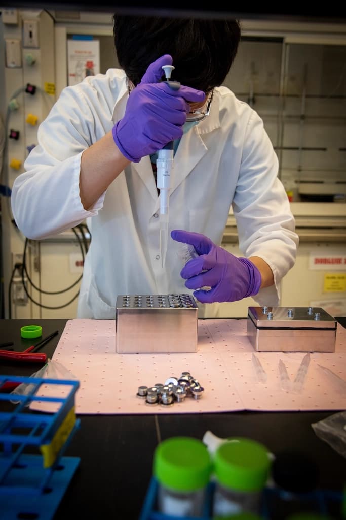Analyst performing a verification test at a laboratory bench