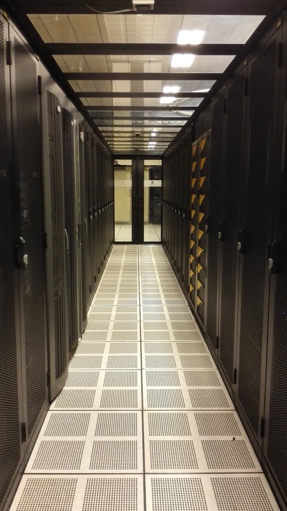 Server racks lining a data centre aisle