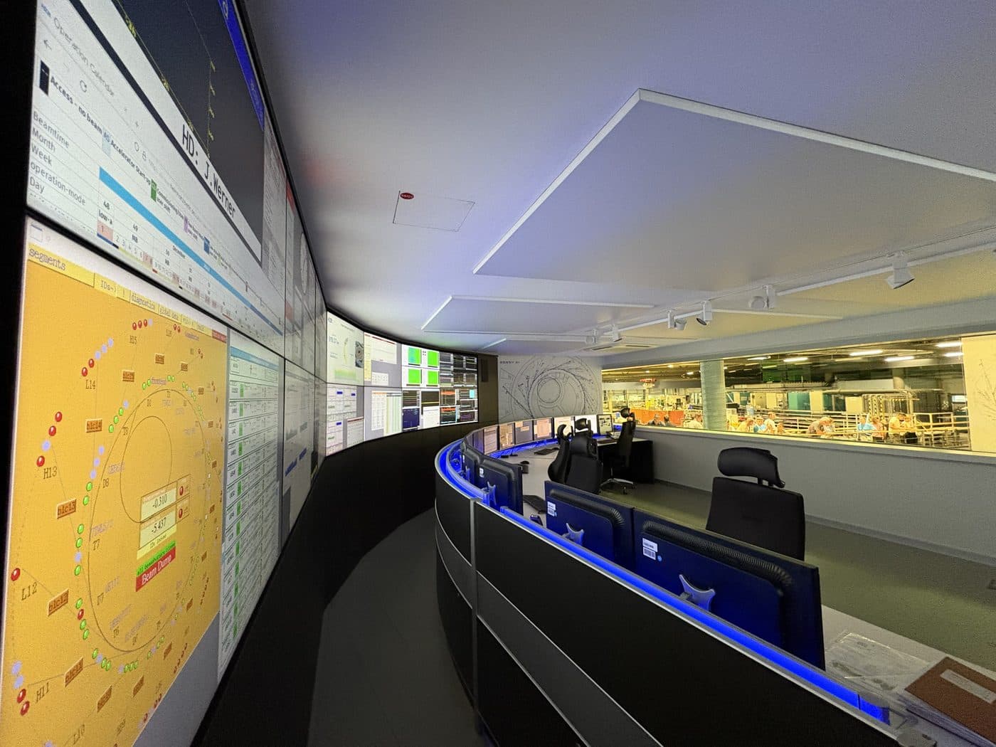 Facility control room with wall-mounted monitoring displays